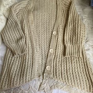 Knit cardigan with lace detailing. Size small.